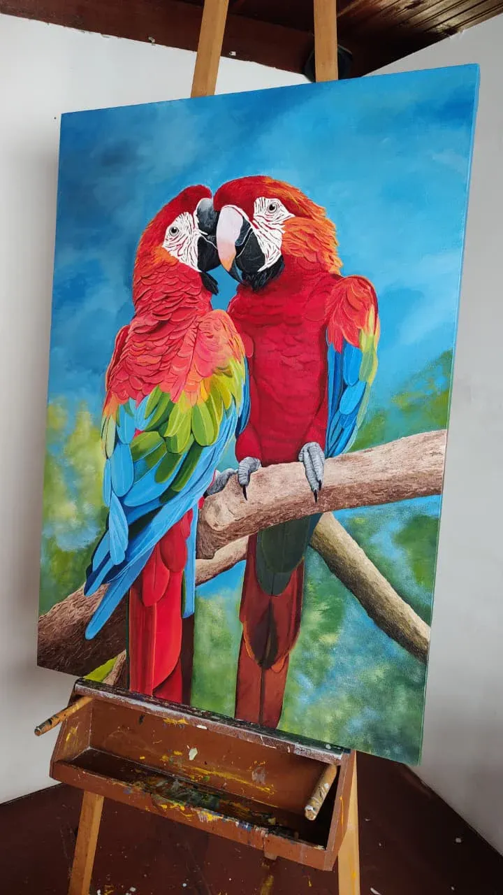 Las guacamayas en el caballete del taller